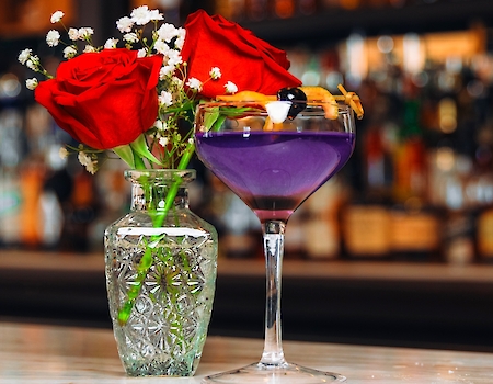 Elegant Lavender Fields cocktail from The Preserve Resort & Spa featured in bar setting