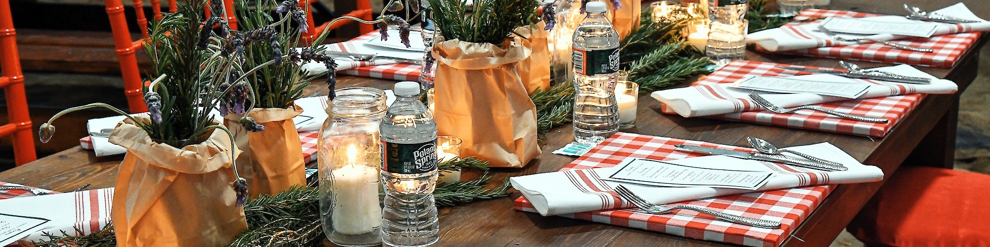 Tables dressed in gingham and natural decor at The Preserve event venue.