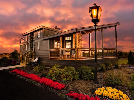 Enjoy the cozy charm of our Tiny Home accommodations at dusk. The Preserve Resort & Spa offers unique stays with a 20% discount when you book direct.